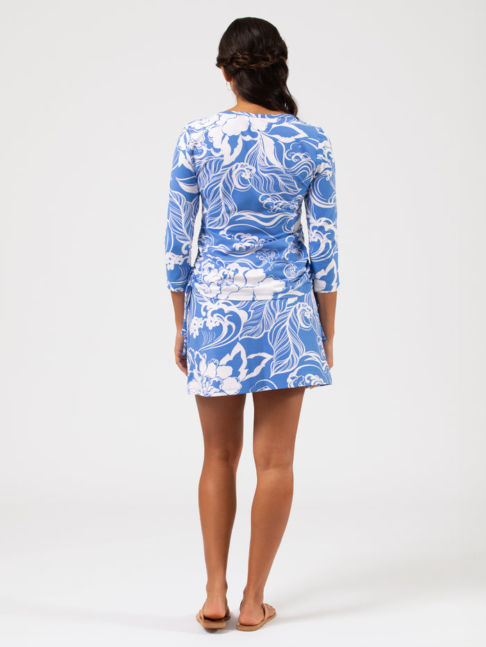 Blue patterned long-sleeve top, back view.