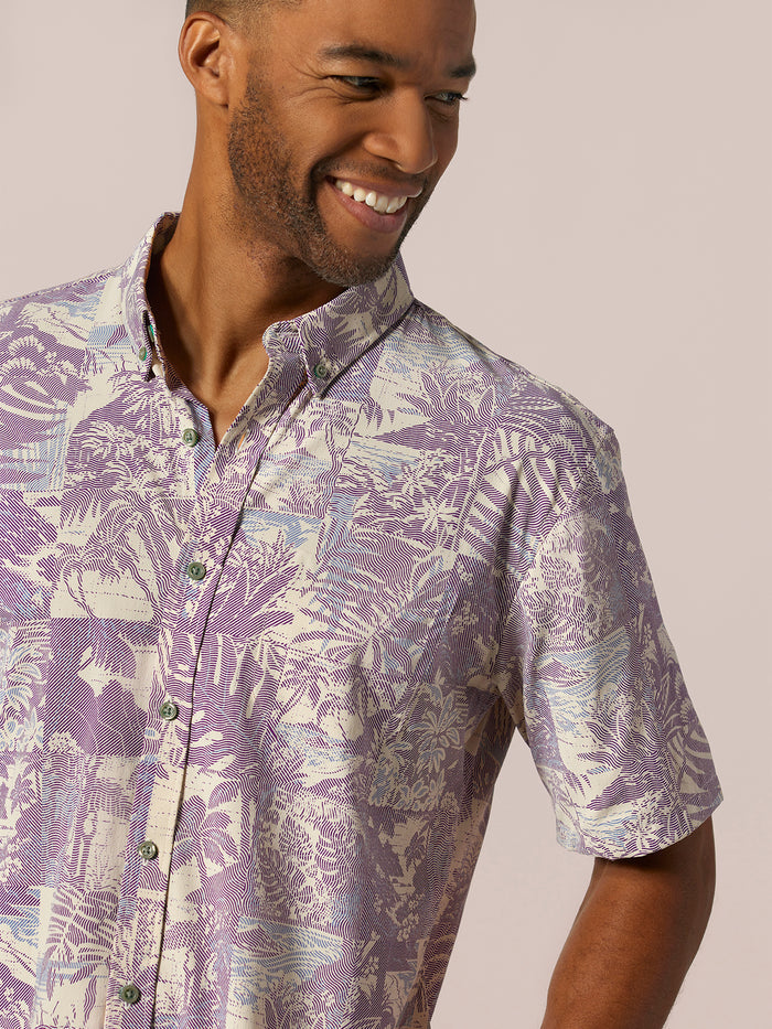 Purple patterned wrinkle-resistant long-sleeve shirt, side view on plain background.
