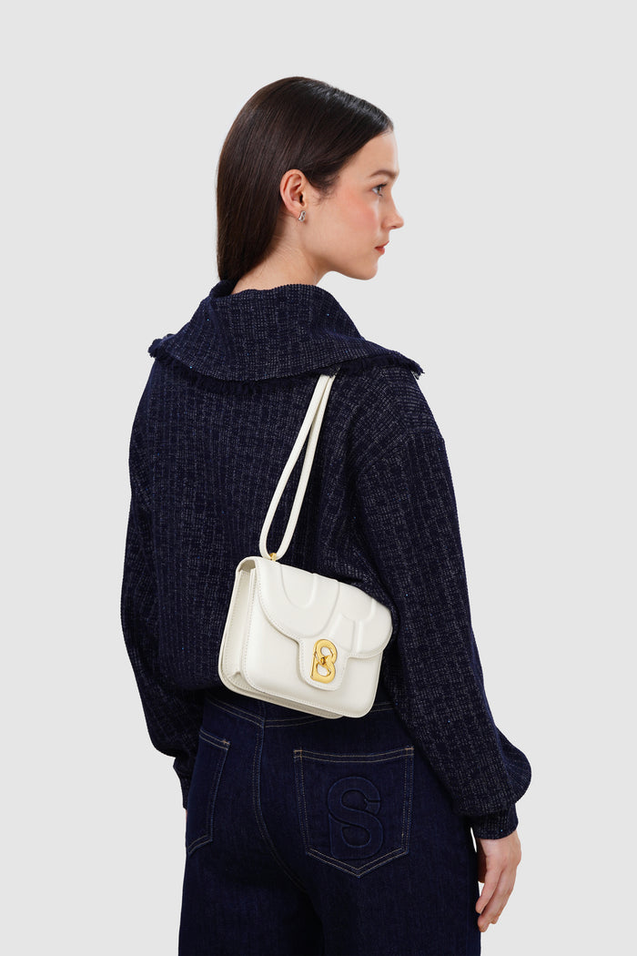 alba bag with sghw in bianco candido by buttonscarves worn as shoulder bag