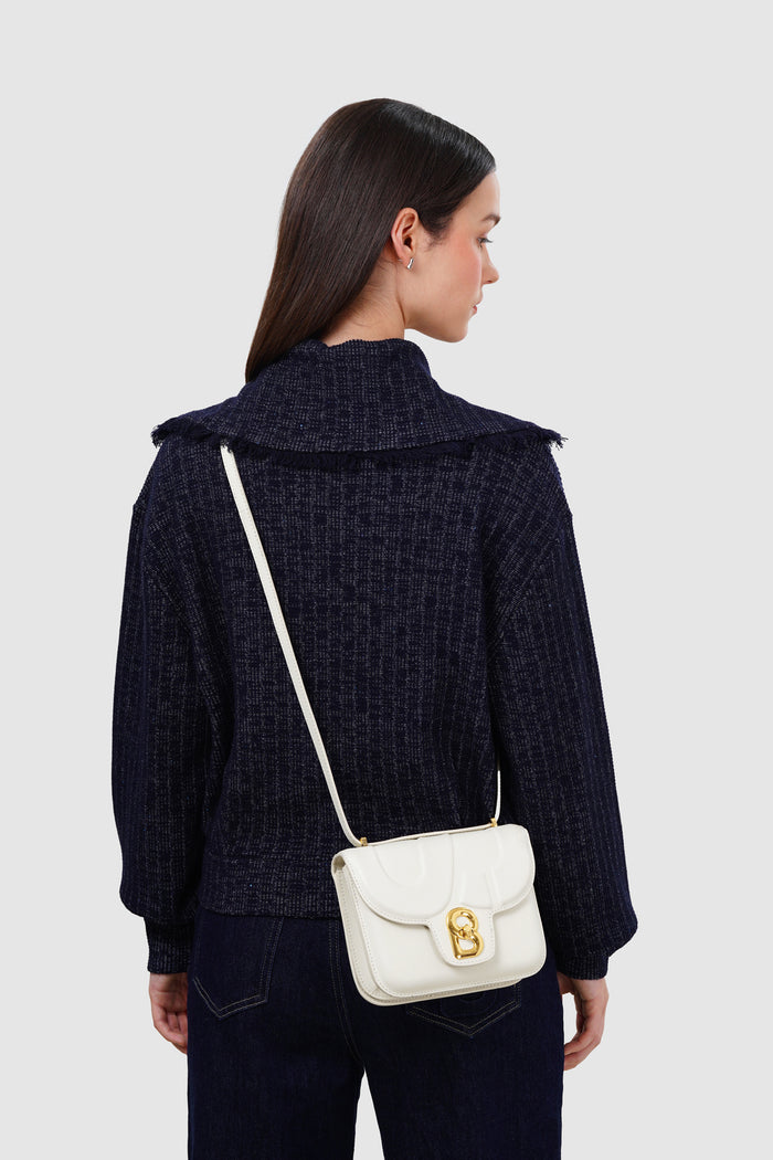 alba bag with sghw in bianco candido by buttonscarves worn as sling bag