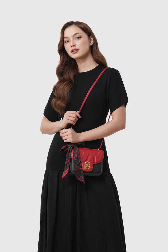 alba bag special edition shoulder bag in black/red by buttonscarves x the devil wears prada 2 carried on shoulder
