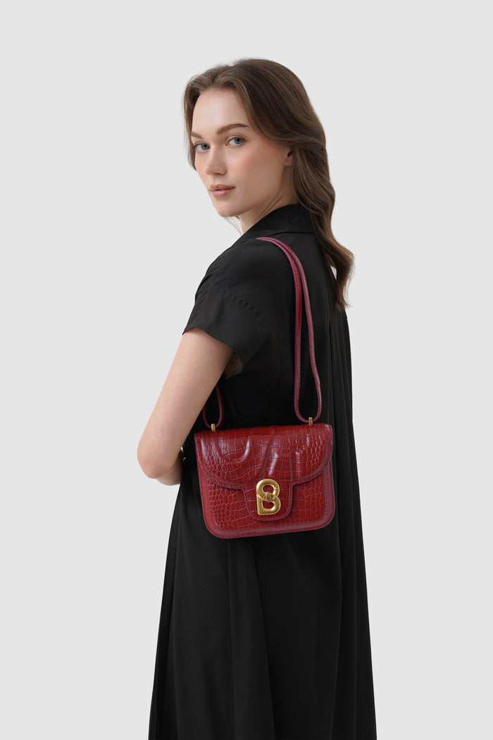 alba bag croco in crimson red by buttonscarves worn as shoulder bag