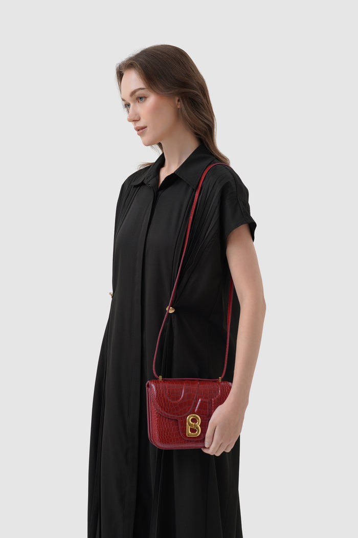 alba bag croco in crimson red by buttonscarves worn as sling bag