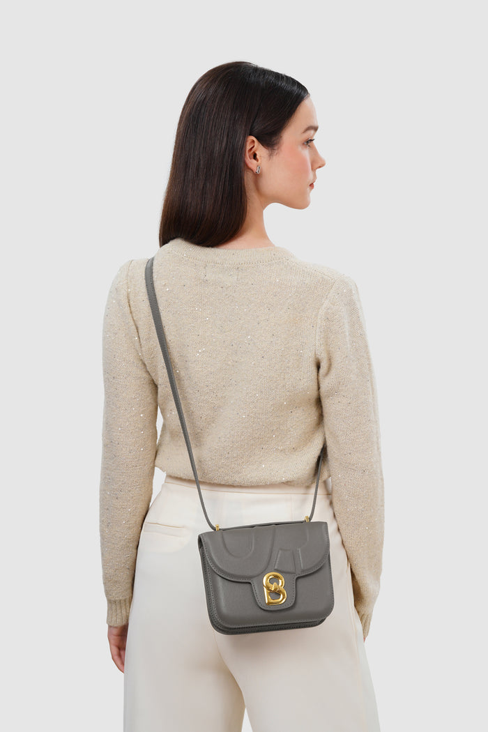alba bag with sghw in fog by buttonscarves worn as sling bag