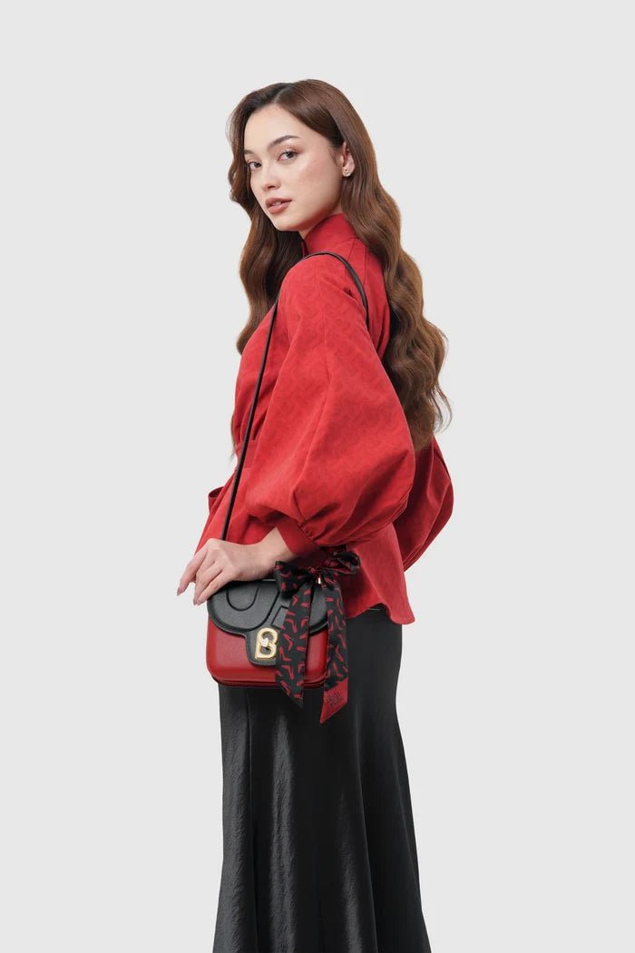 alba bag special edition shoulder bag in red/black by buttonscarves x the devil wears prada 2 carried on shoulder