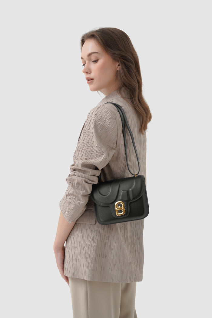 alba bag shiny leather in black by buttonscarves worn as shoulder bag