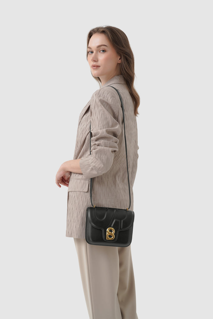 alba bag shiny leather in black by buttonscarves worn as sling bag