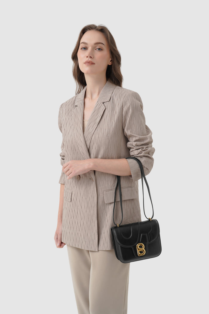 alba bag shiny leather in black by buttonscarves carried on wrist