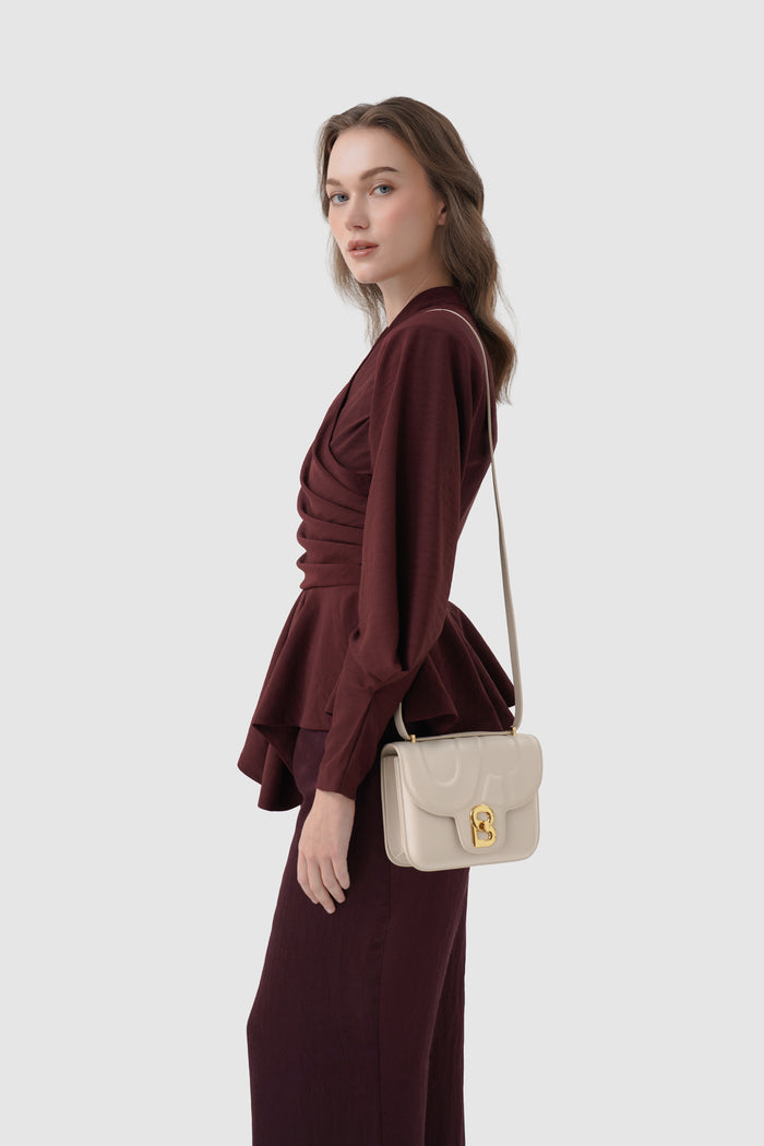 alba bag shiny leather in driftwood by buttonscarves worn as sling bag