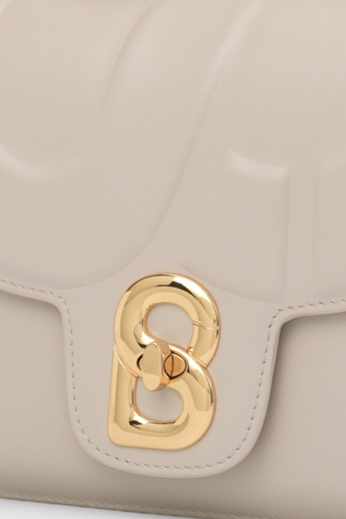 alba bag shiny leather in driftwood by buttonscarves signature b twist lock detail