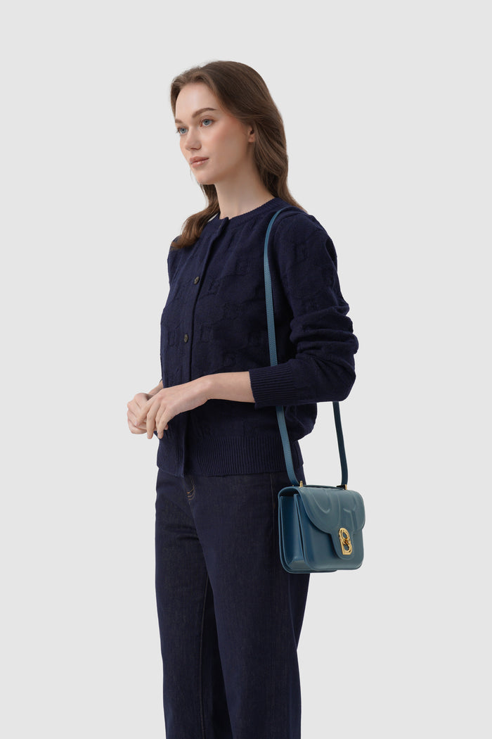 alba bag shiny leather in electric by buttonscarves worn as sling bag