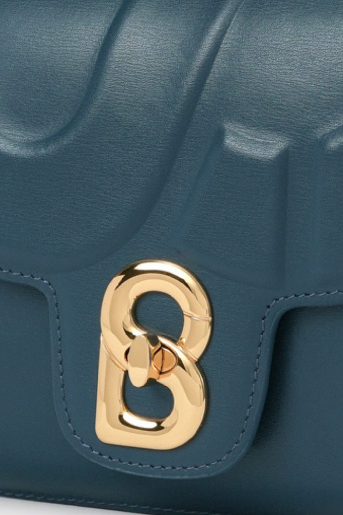 alba bag shiny leather in electric by buttonscarves signature b twist lock detail