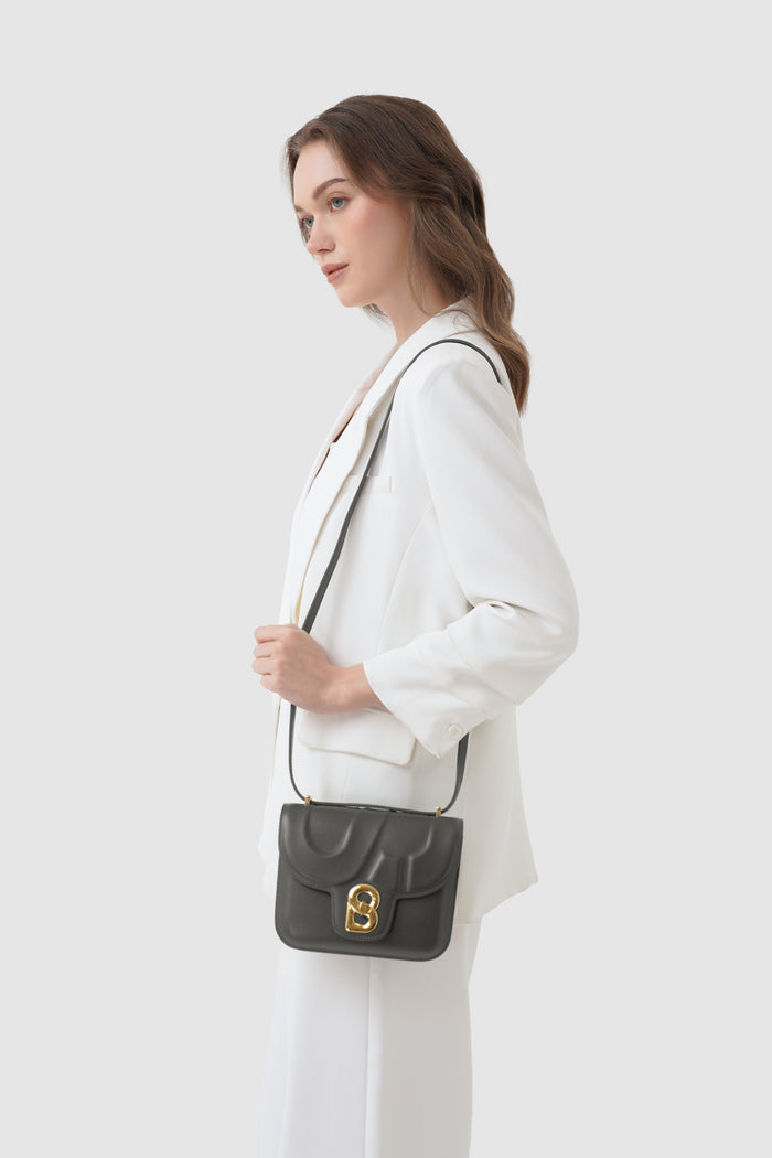 alba bag shiny leather in lava by buttonscarves worn as sling bag
