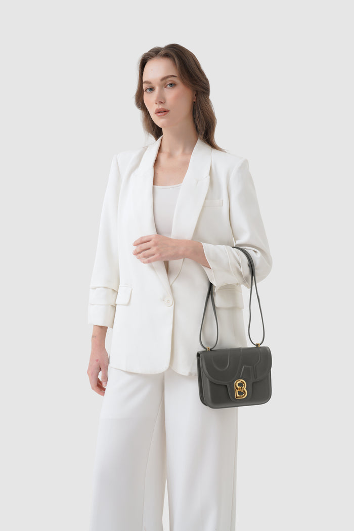 alba bag shiny leather in lava by buttonscarves carried on wrist