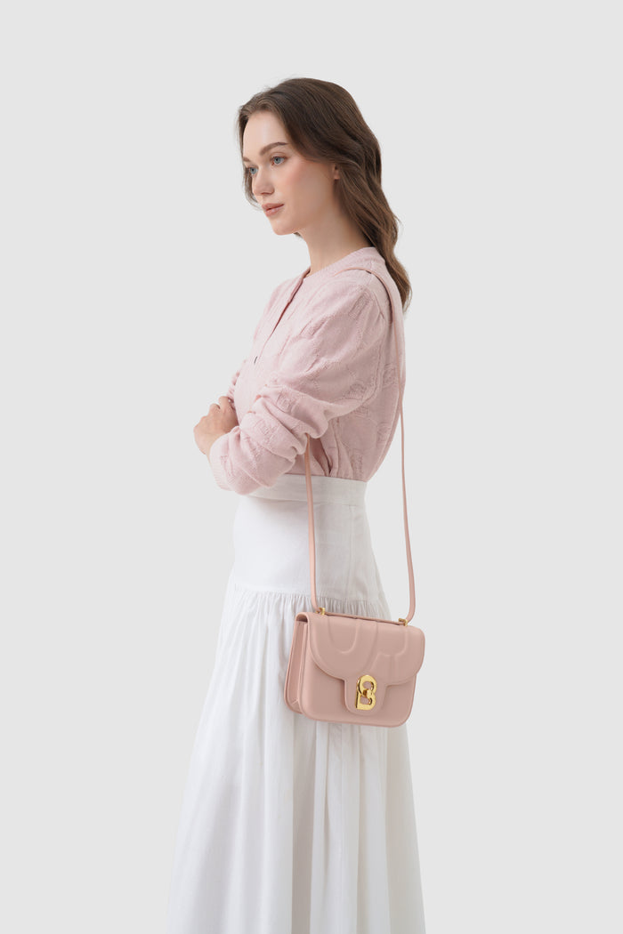 alba bag shiny leather in rosebud by buttonscarves worn as sling bag