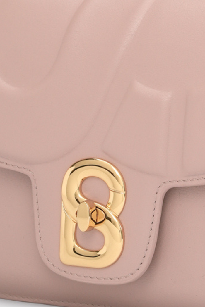 alba bag shiny leather in rosebud by buttonscarves signature b twist lock detail