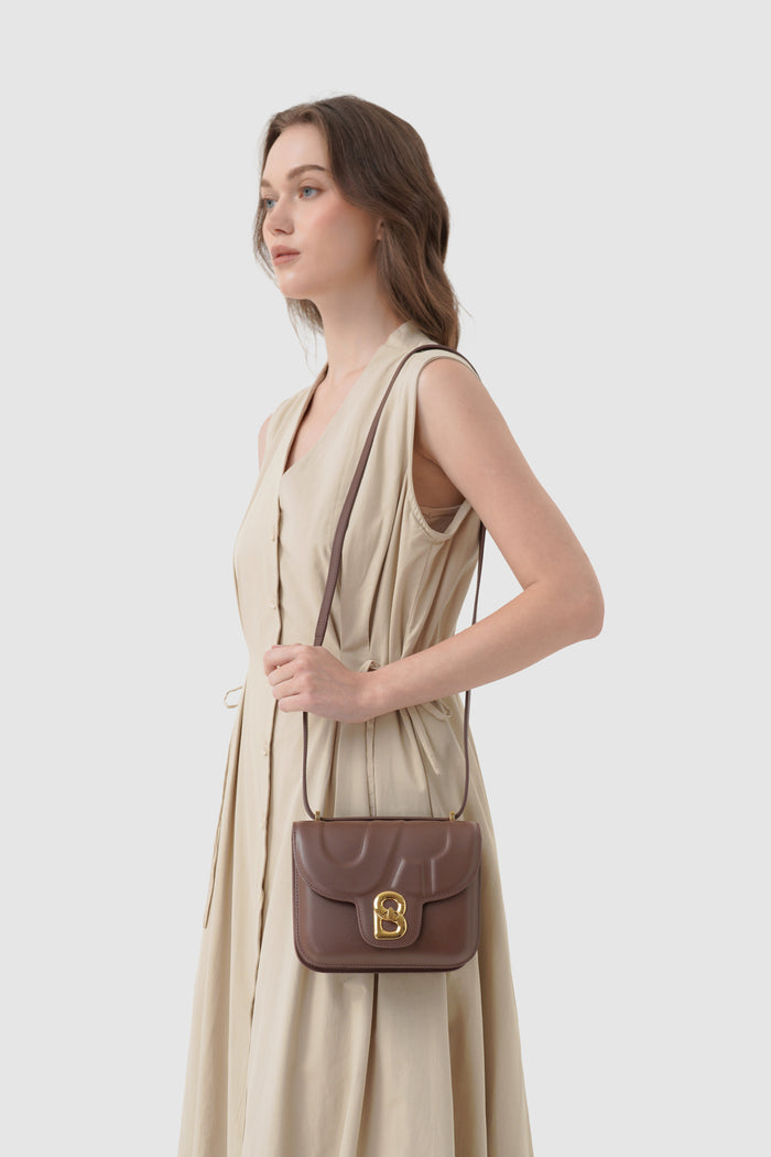alba bag shiny leather in sequoia by buttonscarves worn as sling bag