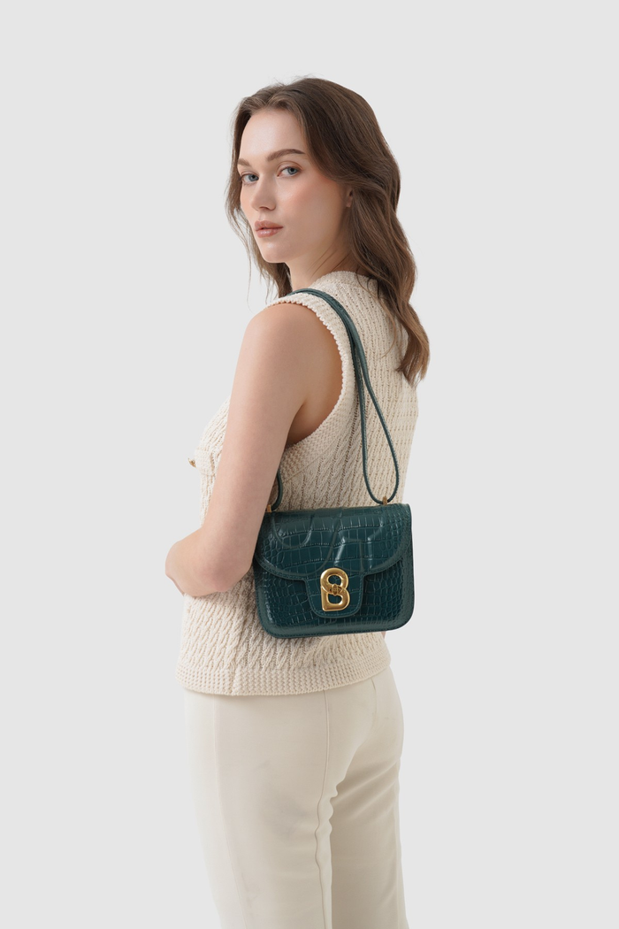 alba bag croco in teal by buttonscarves worn as shoulder bag