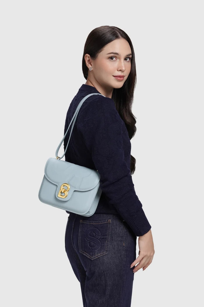alba bag medium in blue by buttonscarves worn on shoulder