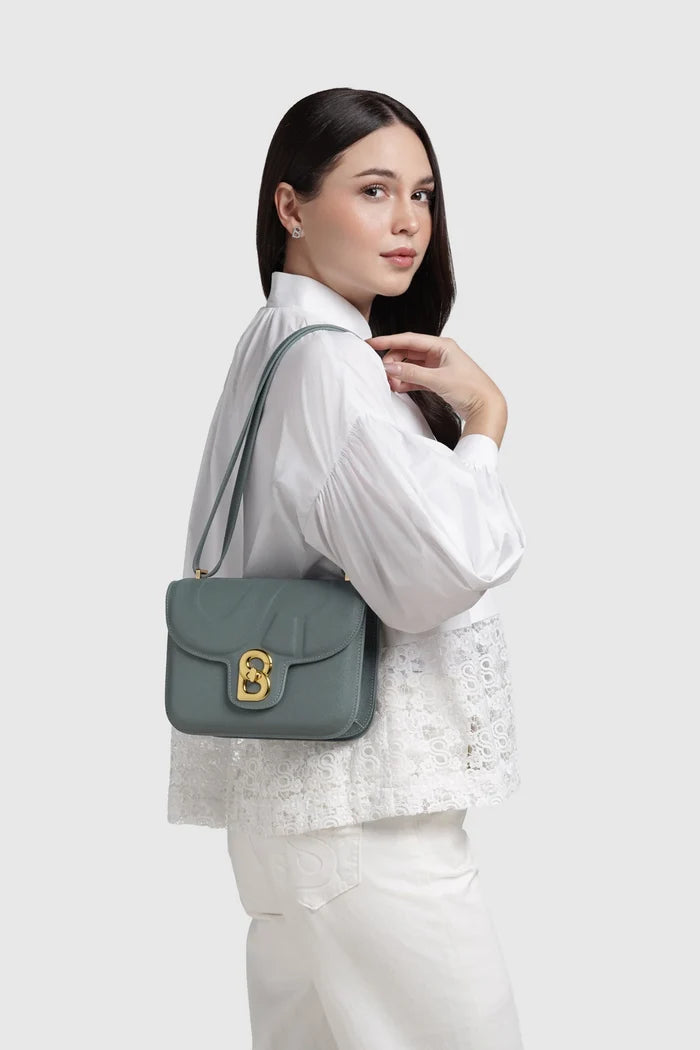 alba bag medium in green by buttonscarves worn on shoulder