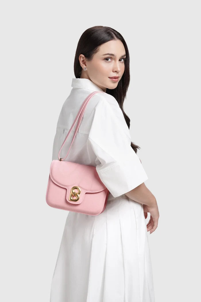 alba bag medium in pink by buttonscarves worn on shoulder