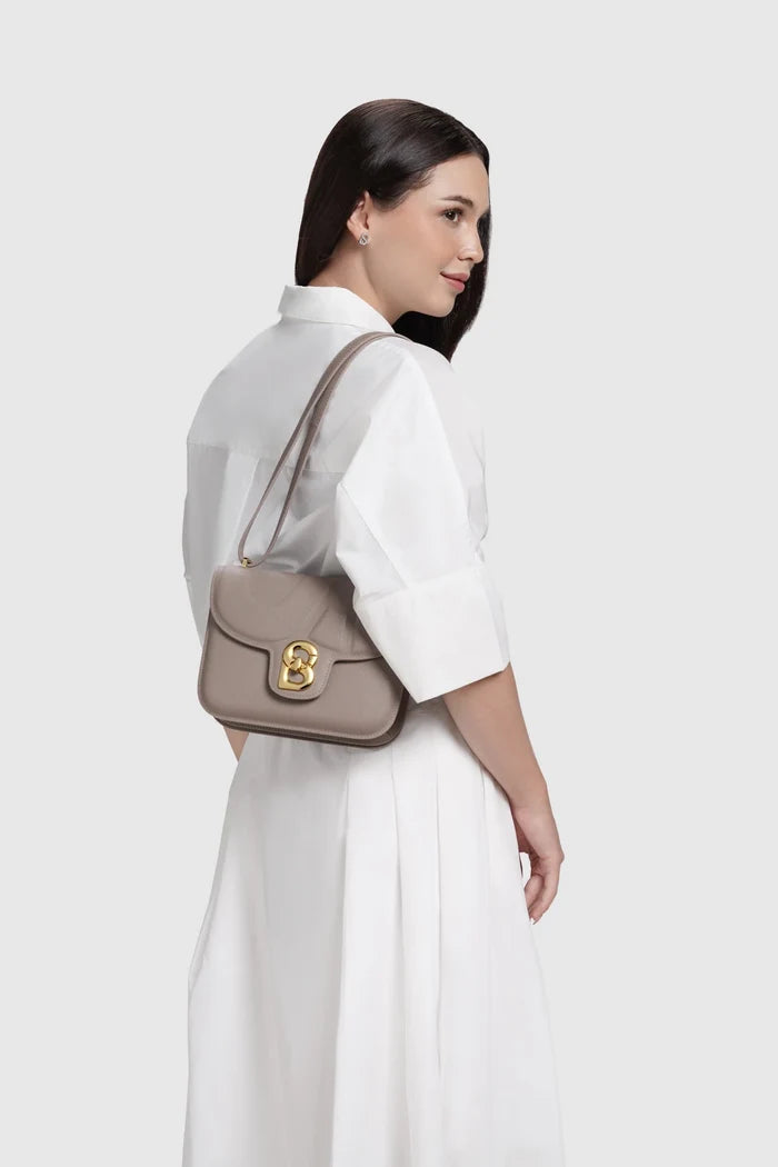 alba bag medium in taupe by buttonscarves worn on shoulder