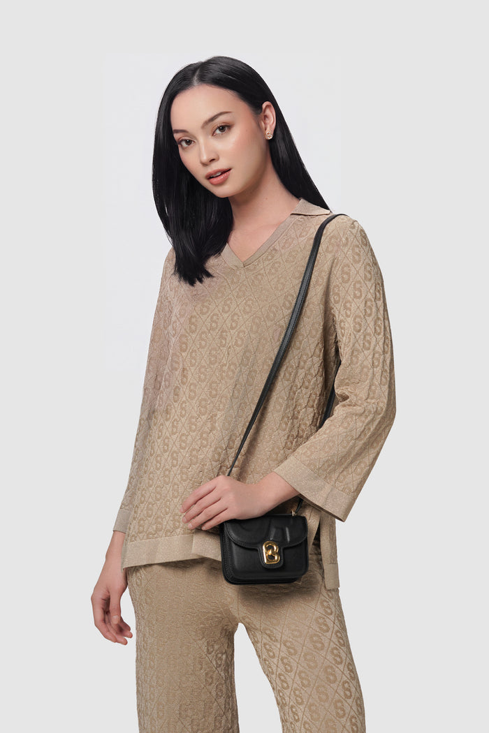 alba bag mini black worn by a woman