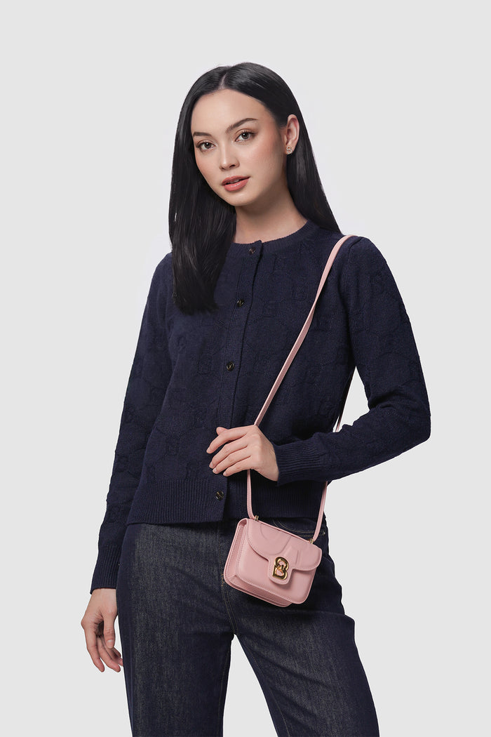 alba bag mini pink worn by a woman