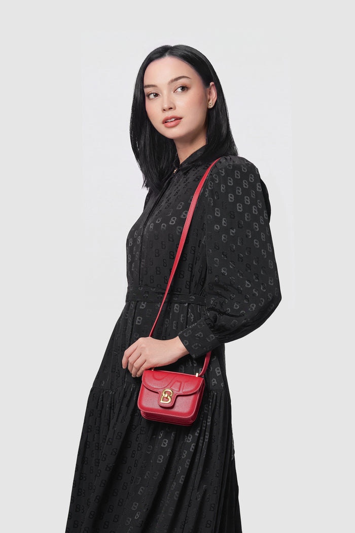 alba bag mini red worn by a woman