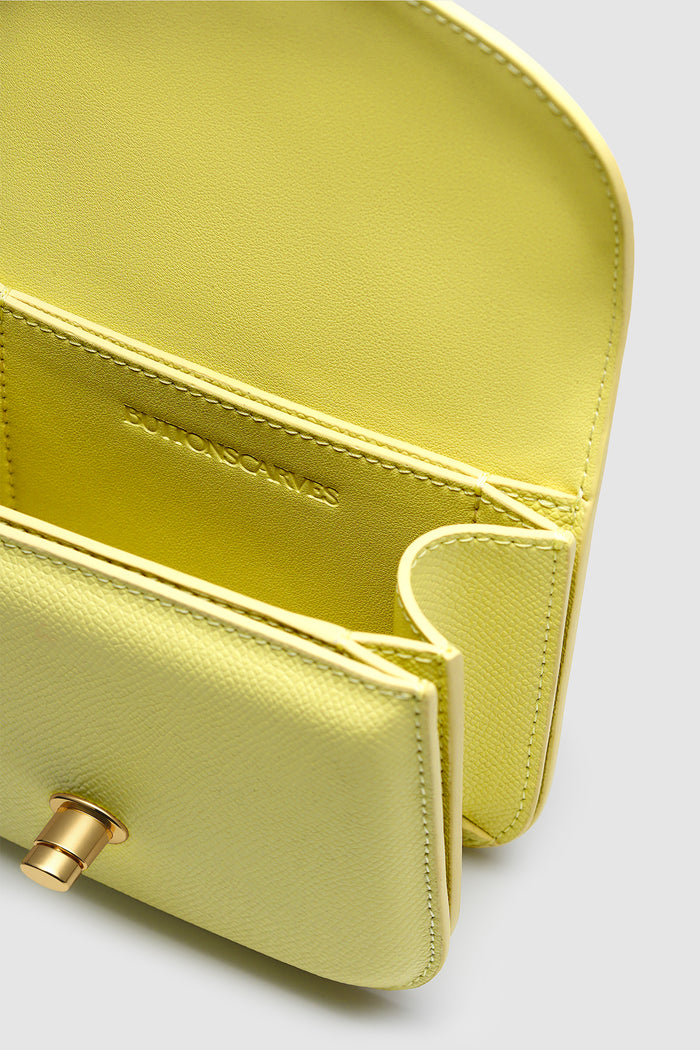 alba bag in yellow detailed view of textured saffiano cow leather