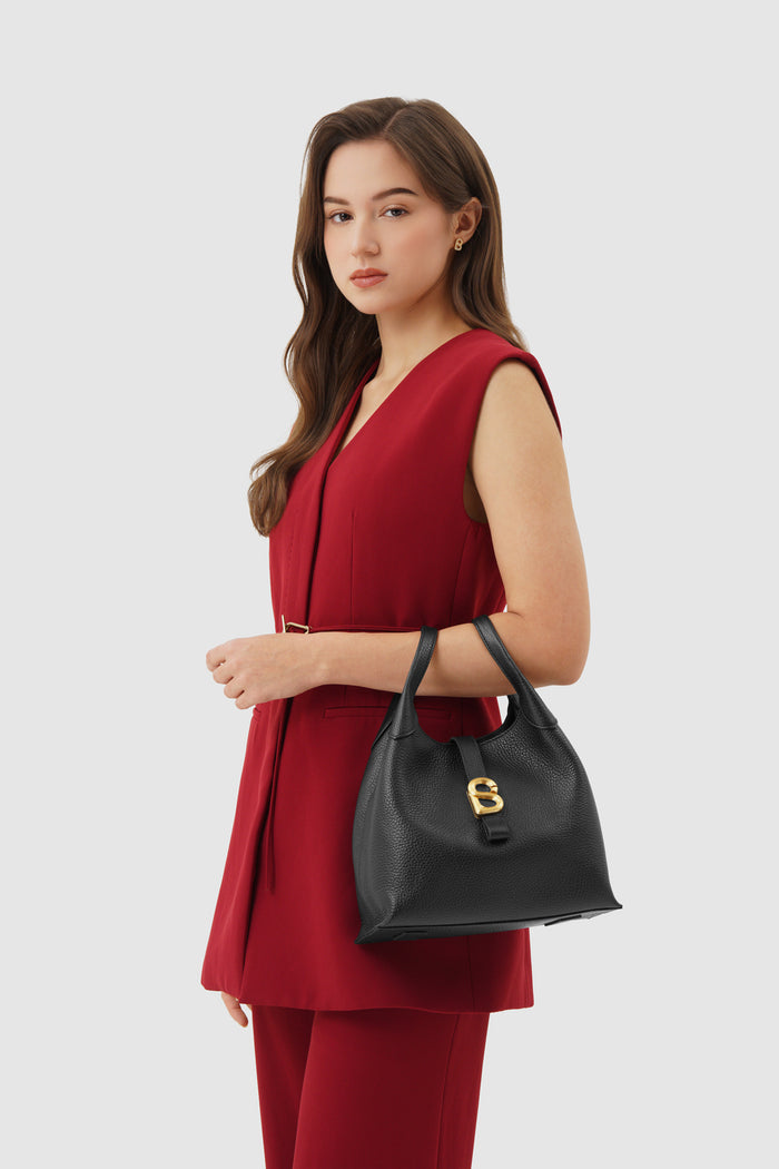 alexandra shoulder bag in black by buttonscarves carried on wrist