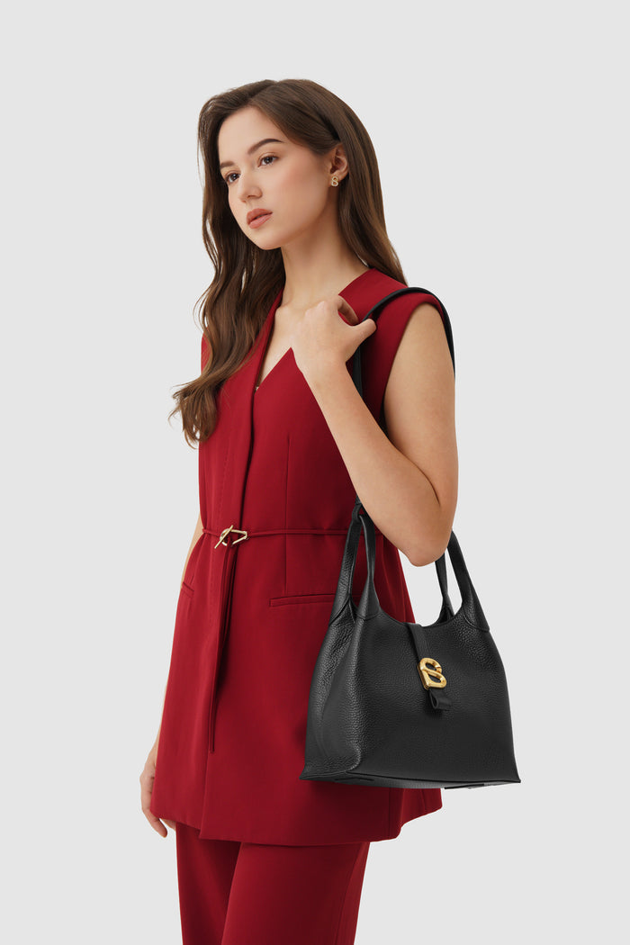 alexandra shoulder bag in black by buttonscarves carried on shoulder