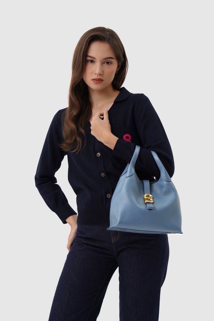 alexandra shoulder bag in blue fairy by buttonscarves carried on wrist