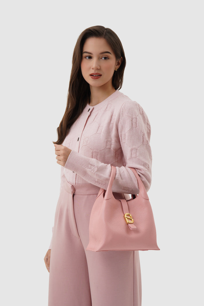 alexandra shoulder bag in blush by buttonscarves carried on wrist