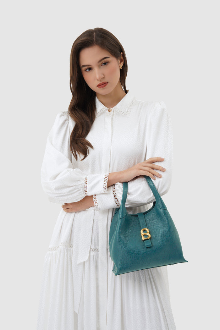 alexandra shoulder bag in jeans by buttonscarves carried on wrist