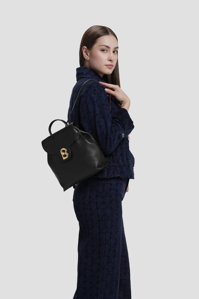 alma backpack in black by buttonscarves worn on back