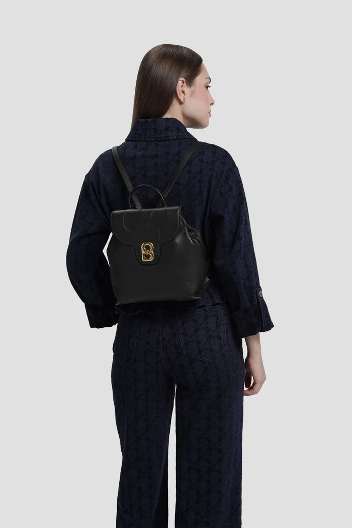 alma backpack in black by buttonscarves worn on back