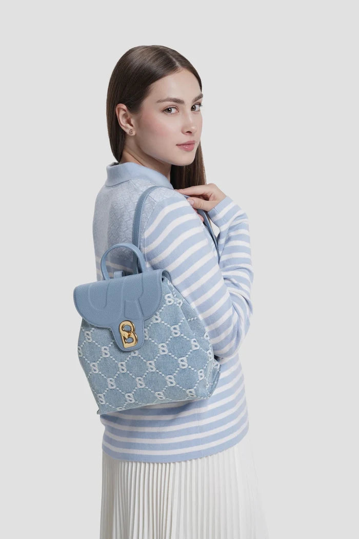 alma backpack in denim by buttonscarves worn on back