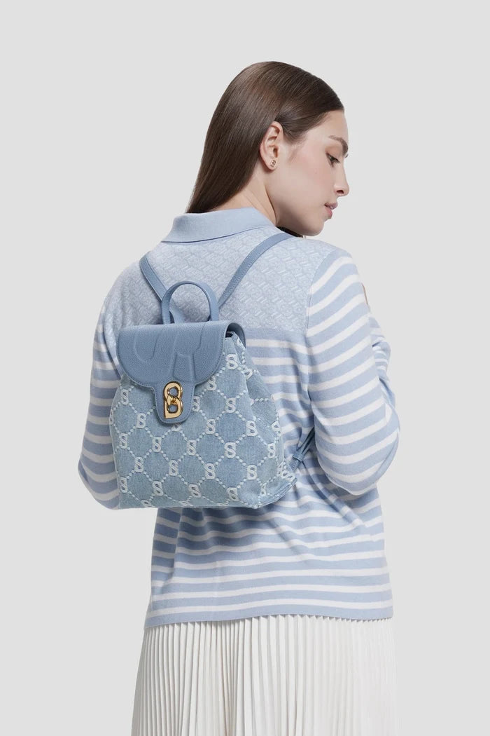 alma backpack in denim by buttonscarves worn on back