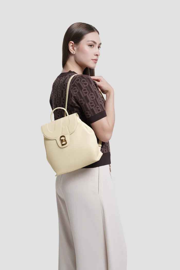 alma backpack in lamb by buttonscarves worn on back