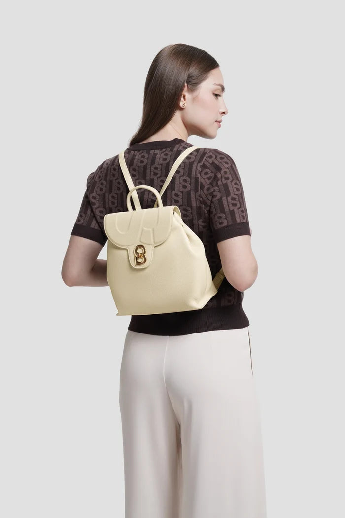 alma backpack in lamb by buttonscarves worn on back