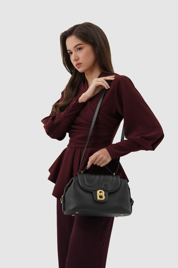 alma shoulder bag in black by buttonscarves with adjustable strap
