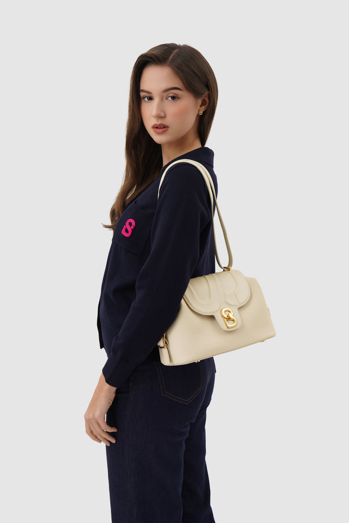 alma shoulder bag in chalk by buttonscarves carried on shoulder