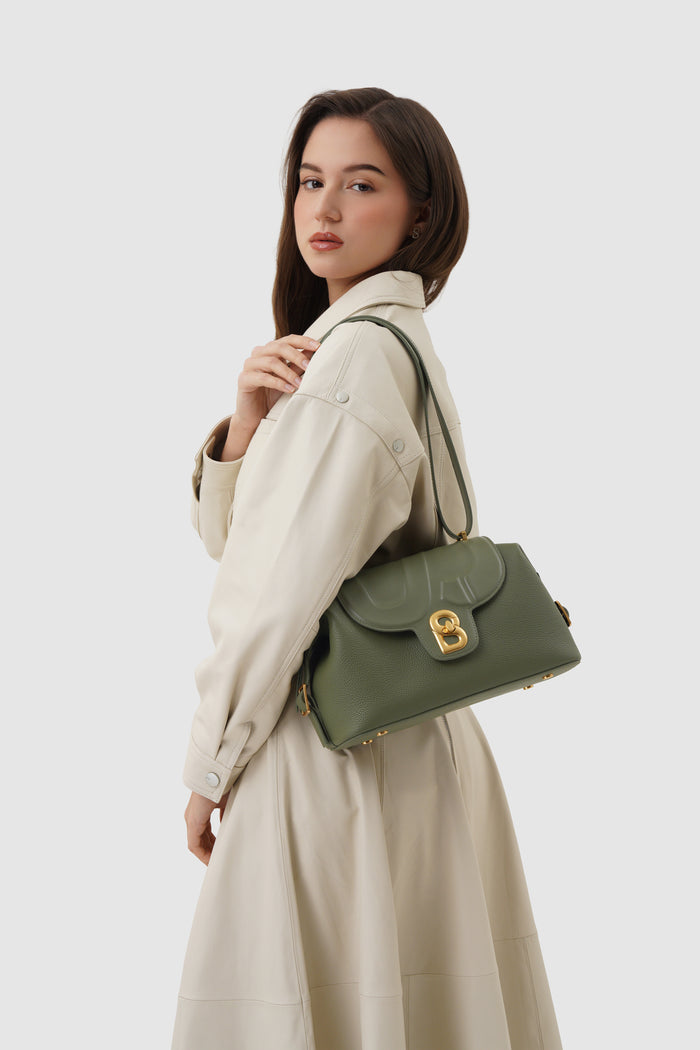 alma shoulder bag in olive by buttonscarves carried on shoulder