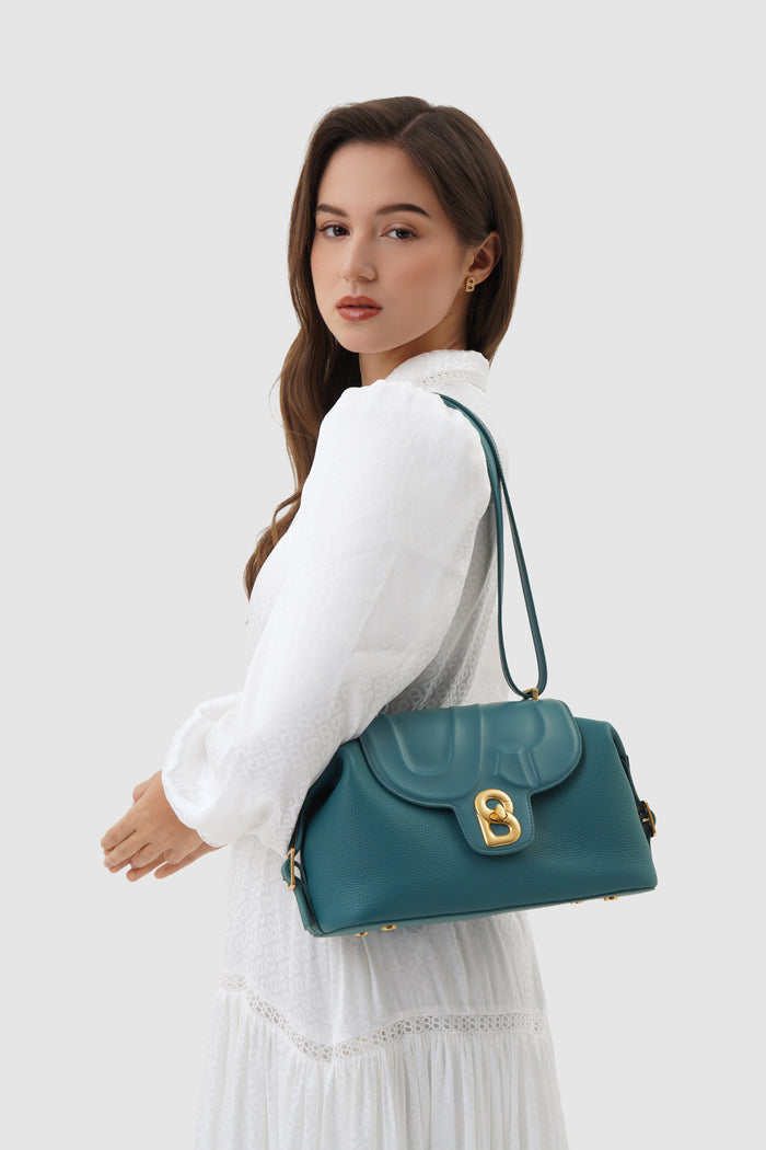 alma shoulder bag in teal by buttonscarves carried on shoulder
