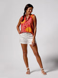 Yellow and red floral-print blouse, white shorts, and sandals, full front view of outfit shown.