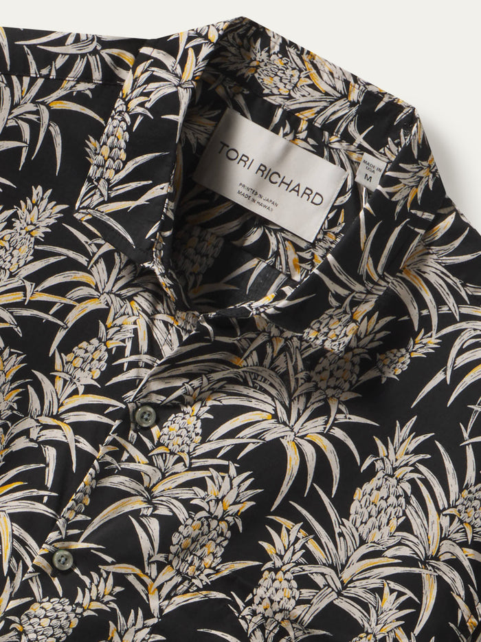 Black shirt with white and yellow pineapple print, cotton lawn fabric, shown from front and front detail views.
