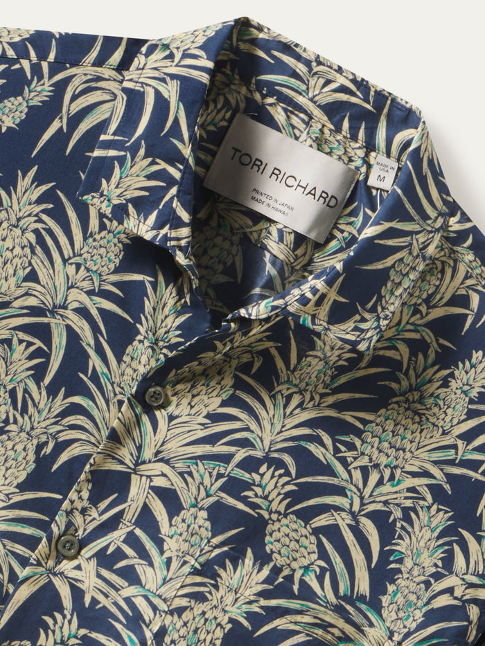 Navy cotton shirt with beige palm leaf and pineapple print, front view.
