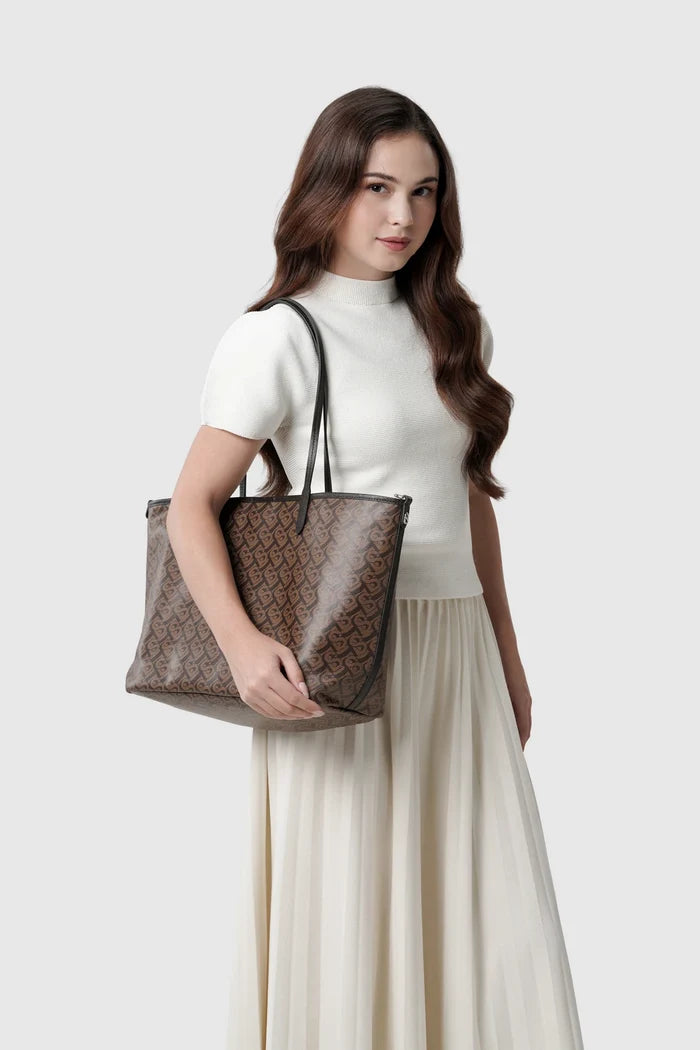 anya tote bag in brown by buttonscarves carried on shoulder