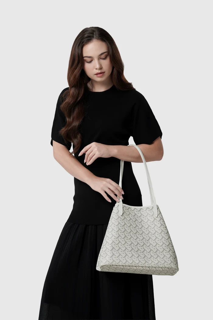 anya tote bag in white by buttonscarves carried on wrist